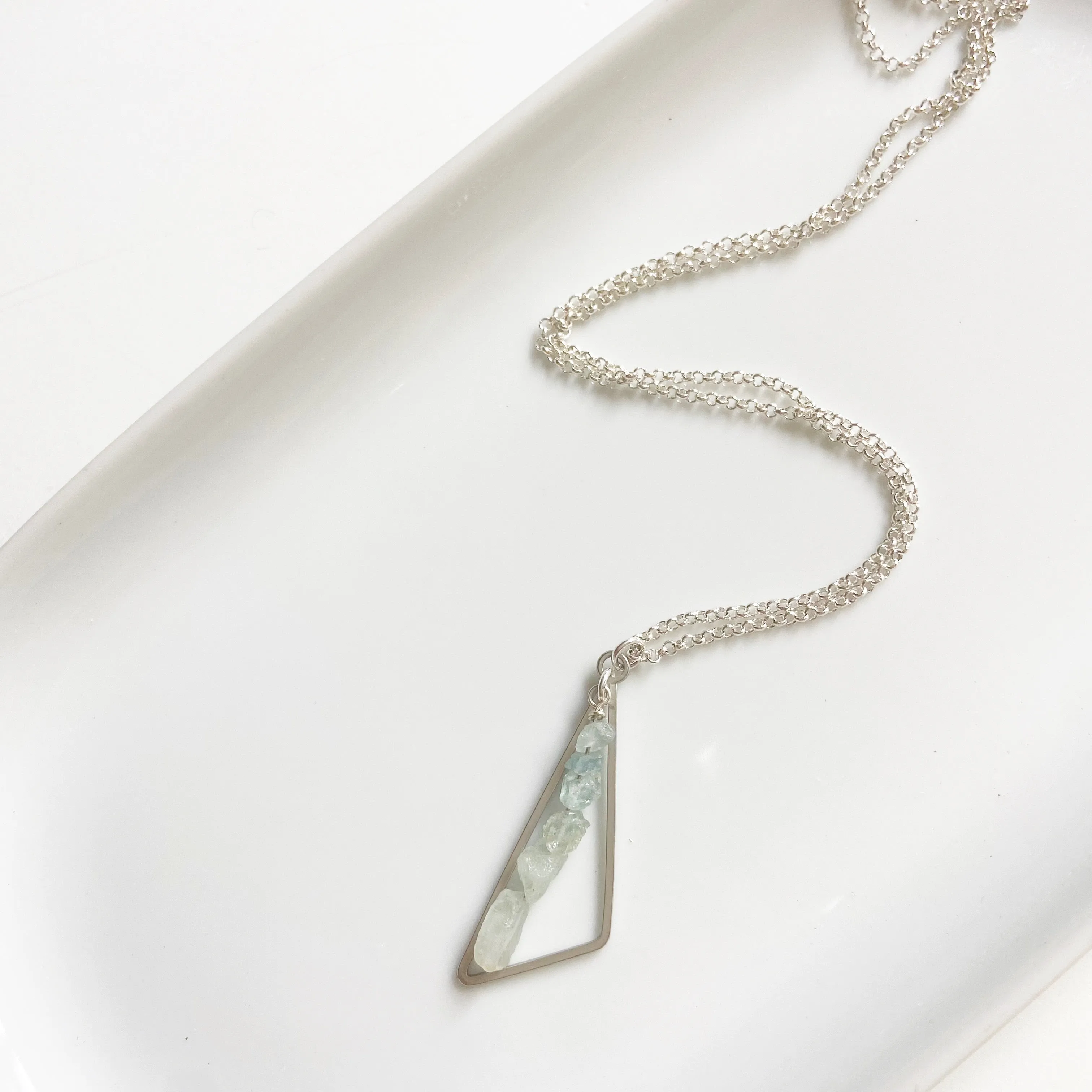 Rough cut aquamarine triangle pendant in silver